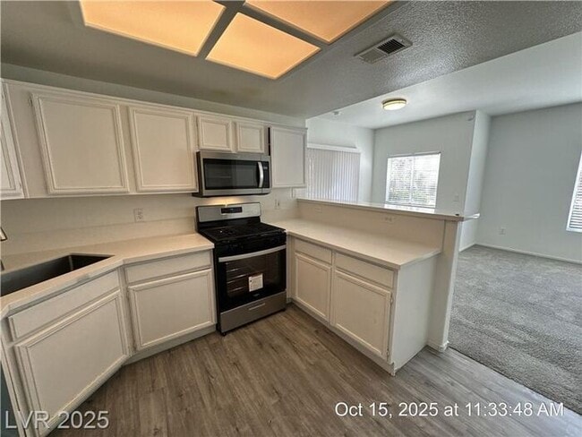 Building Photo - SPACIOUS FIRST-FLOOR CONDO LOCATED IN A GATED COMMUNITY!