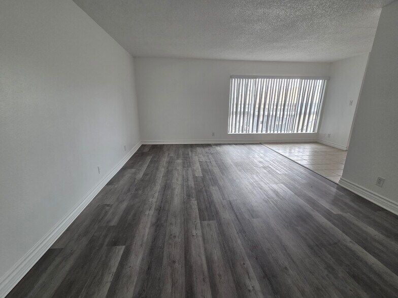 Living room with Luxury Vinyl Plank - 3455 Elm Ave