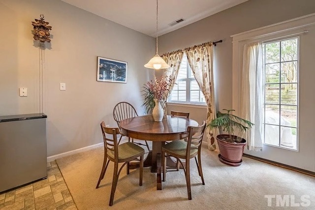 eating area with view of patio and wooded backyard - 245 Plaza Dr