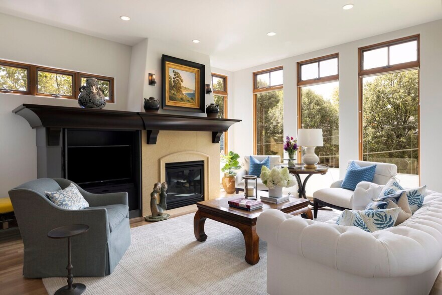 Cozy up by the elegant gas fireplace, the perfect centerpiece for warmth and ambiance - 745 Rice St E