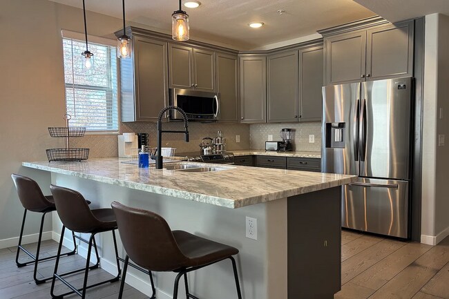 Building Photo - Welcome Home! Fully Furnished with Month to Month leasing options available. Contact us today to ...