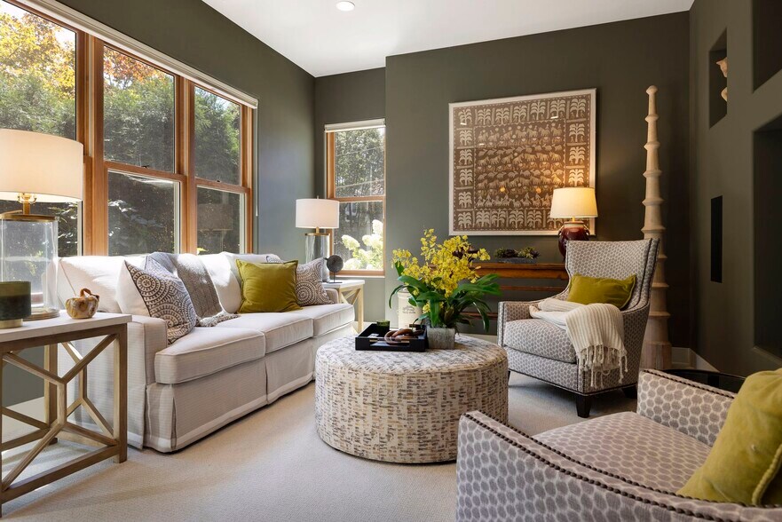 The lower level offers entertaining space, a wet bar, exercise room, and access to the walkout patio - 745 Rice St E