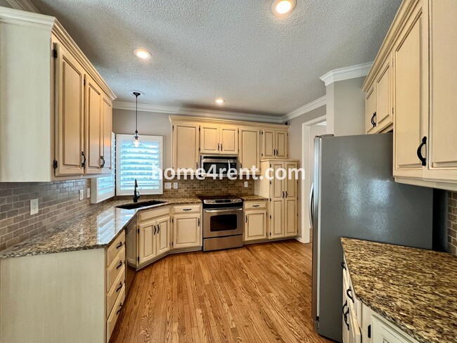 Building Photo - Updated Kitchen, Large Two Tiered Deck, Finished Basement in Blue Valley Schools!