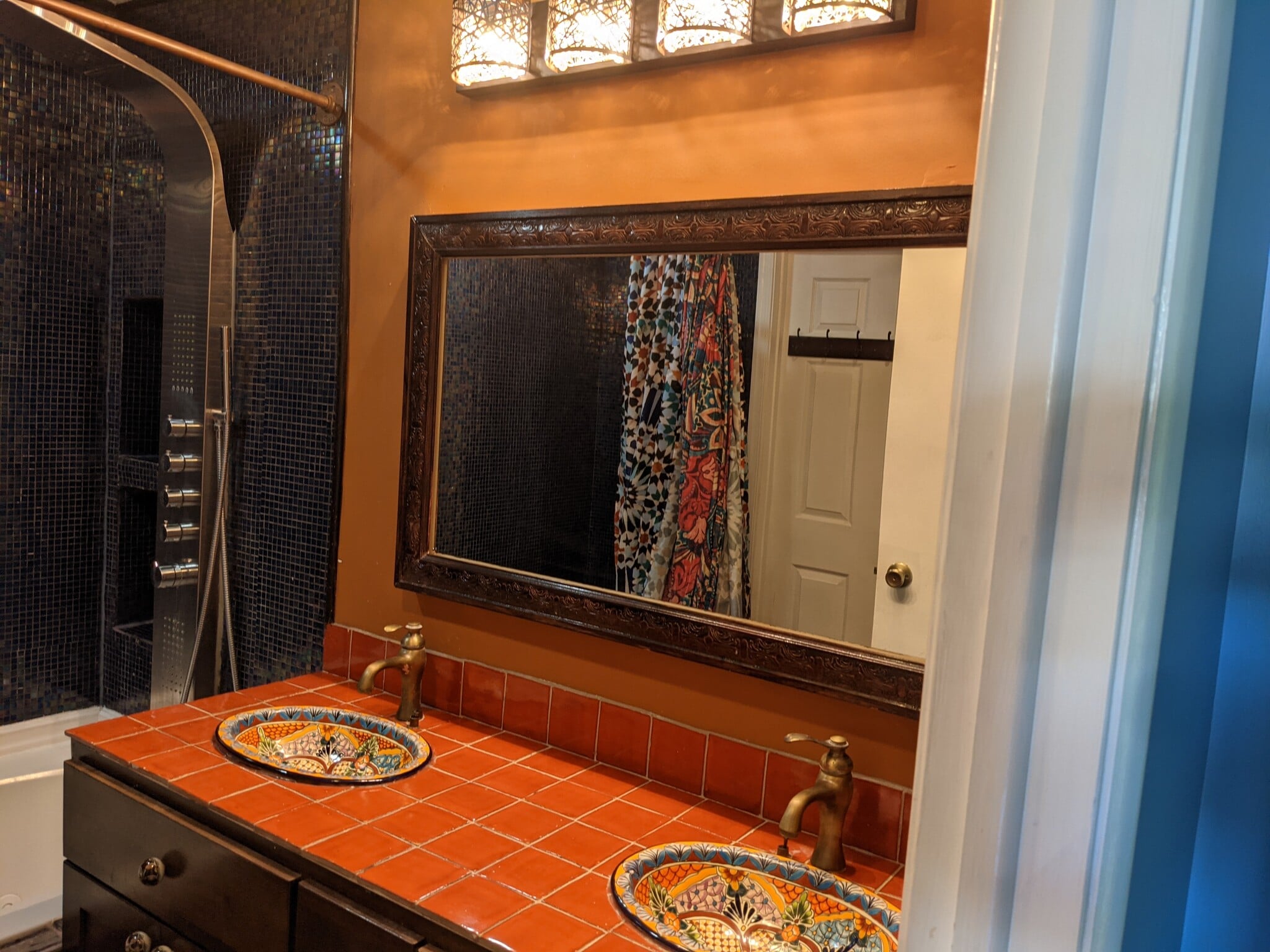 Master upstairs bathroom with custom tilework, Mexican sinks, and shower panel - 2854 S Meade St