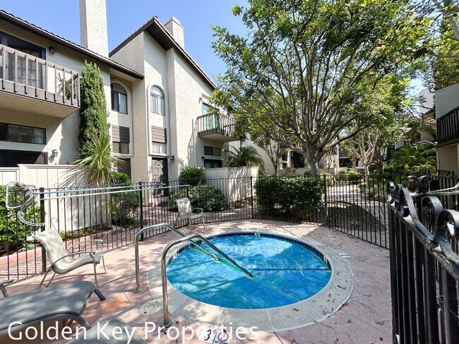 Building Photo - Welcome to this stunning ***unfurnished*** tri-level condo in the desirable Casitas de la Costa c...