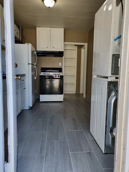 kitchen brand new flooring and cabinets - 6414 10th Ave