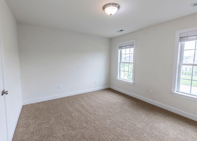 Building Photo - Huge house with vaulted ceilings and fenced in rear yard
