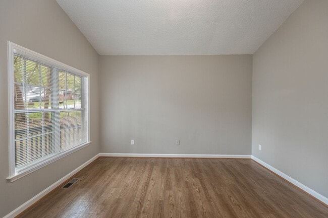 Building Photo - Like New Home off Freeman Mill.  Just Painted, New Wood/Vinyl Flooring, Vaulted Ceilings, Front P...