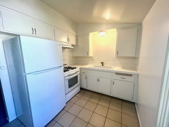 Building Photo - Spacious Two Bedroom with New Carpet - Available Now!