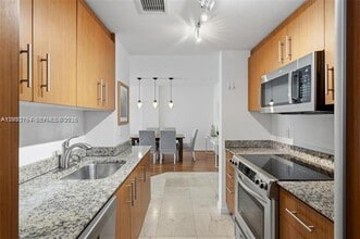 Building Photo - 10275 Collins Ave