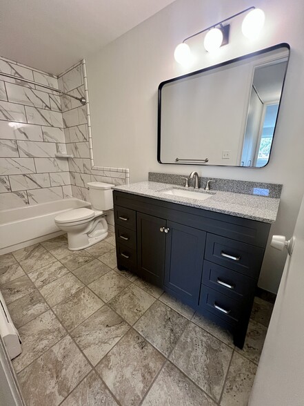 2BR, 1BA - 1,025SF Bathroom - Camelot Apartments