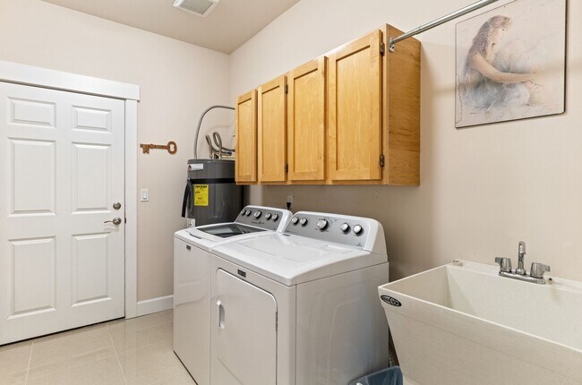 Building Photo - 3-bedroom, 2-bathroom home featuring an op...