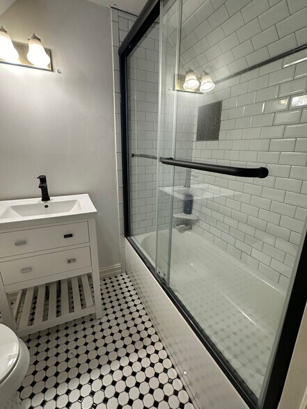 New tile floor & vanity in Full Bath Upstairs - 1203 E 25th St