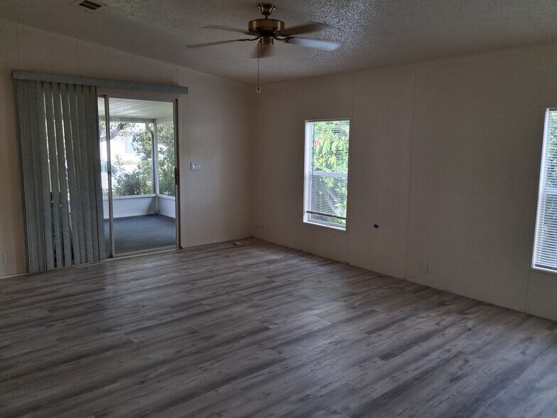 Living room and screened porch - 35303 SW 180th Ave