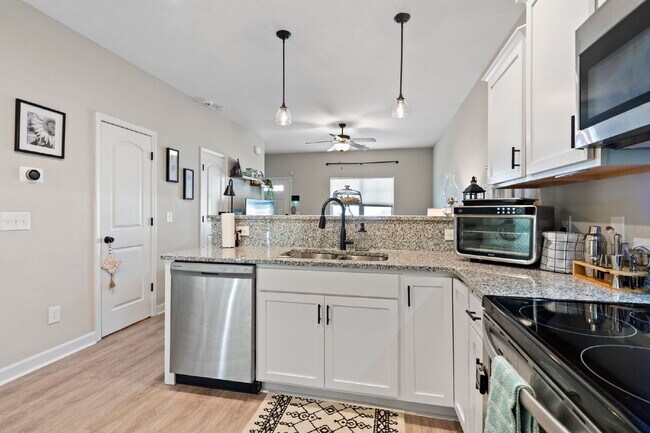 Building Photo - Available Now! Enjoy low-maintenance coastal living in this beautiful 2-bedroom, 2.5-bath townhom...