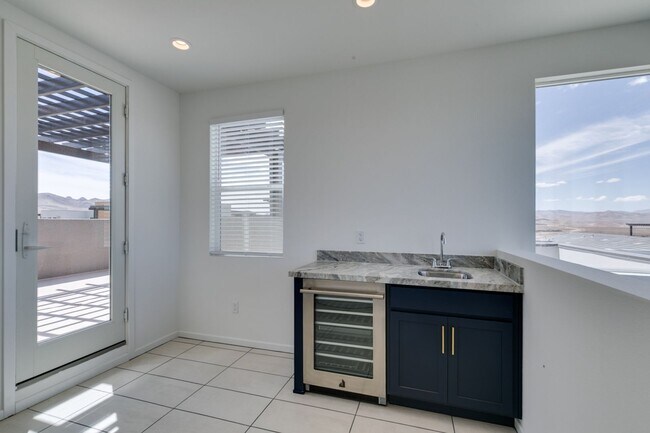 Building Photo - Stunning 4-Level Townhome in Inspirada | R...