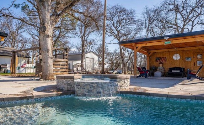 Building Photo - A Private Oasis with Unmatched Amenities 4 Bedroom 3 Bath