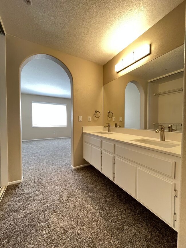 Building Photo - PICTURE PERFECT!  3 BR/3 BA END UNIT CONDO with DIRECT ACCESS 2 CAR GARAGE