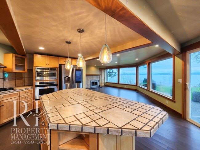 Building Photo - MOVE-IN SPECIAL: 50% OFF FIRST MONTHS RENT - Waterfront Rustic Retreat with Vaulted Ceilings, Pic...