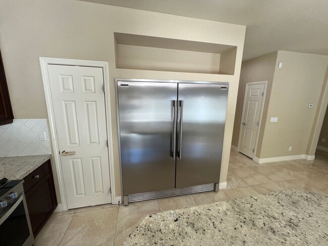 Building Photo - A Fantastic 4 Bedroom Home with the primary Downstairs, in Silverado Ranch