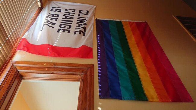 Stairwell with some of our flags - 1128 Avenue M 1/2