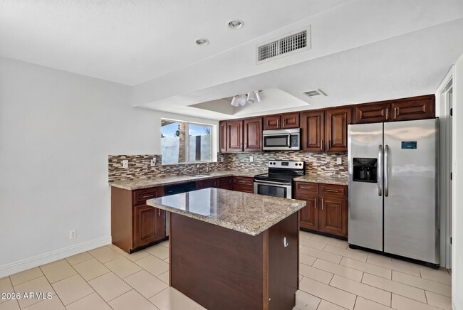 Building Photo - 8832 E Lupine Ave