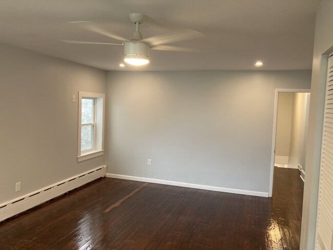 From the 2nd floor hall, you'll enter the primary bedroom. This large room has 3 windows, 2 closets - 2621 E Somerset St