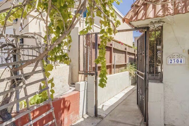 Step into the private outdoor space through the gated backyard - 2304 E 14th St