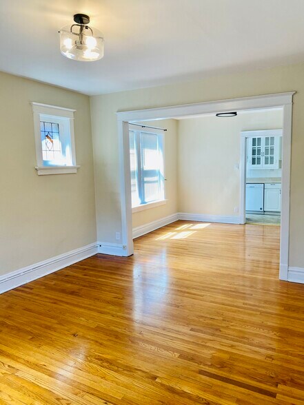 Living Room and Dining Room, original hardwoods that have been refinished - 2127 Alfred Ave