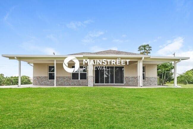 Building Photo - 3 Bedroom Pet-Friendly Home in LEHIGH ACRES, FL with Main Street Renewal