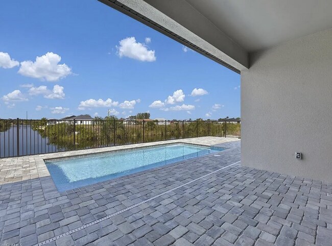 Building Photo - Almost New Construction Waterfront Home in NE Cape Featuring A Pool, Fenced Yard & More! COMING SOON