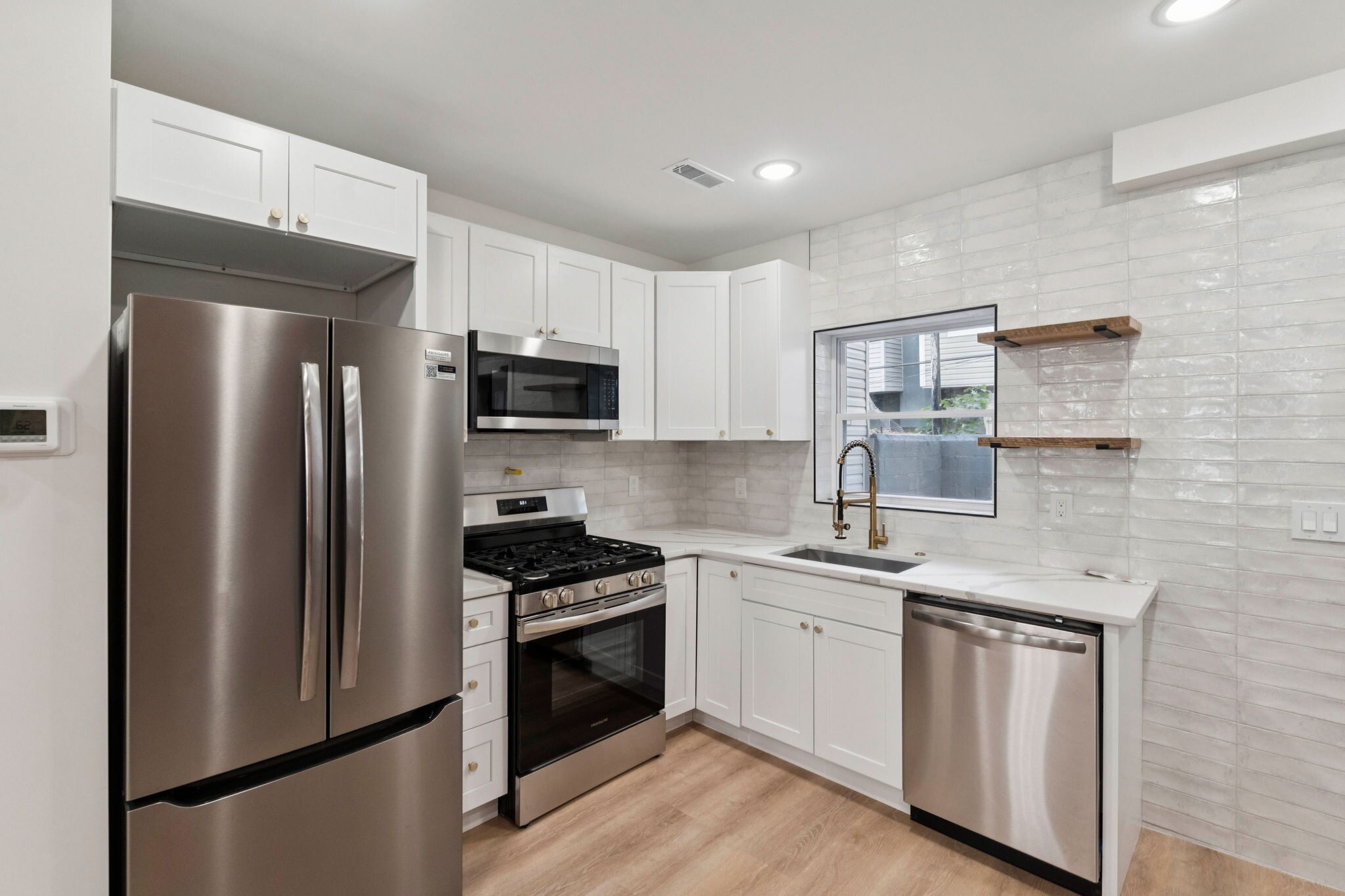 Kitchen with stone countertop and stainless steel appliances - 1544 S Bambrey St