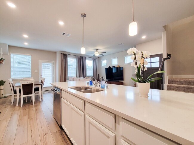 Building Photo - A true gem on a quiet corner lot, this spacious and sun-filled home is tucked away from street no...