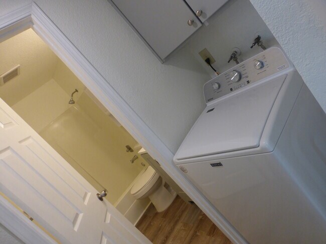 New washing machine with cabinets above - 215 8th St SE