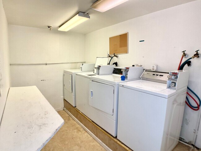 Building Photo - TOP FLOOR, Corner Studio. Hardwood Floors!...