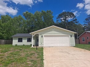 Building Photo - UPDATED 3BR 2BA WITH 2 CAR GARAGE FOR RENT