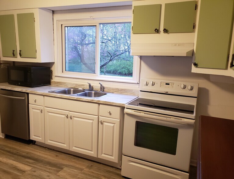 Huge sliding window allows for a great view of the backyard and lets in plenty of natural light. - 10106 Wingfield Rd