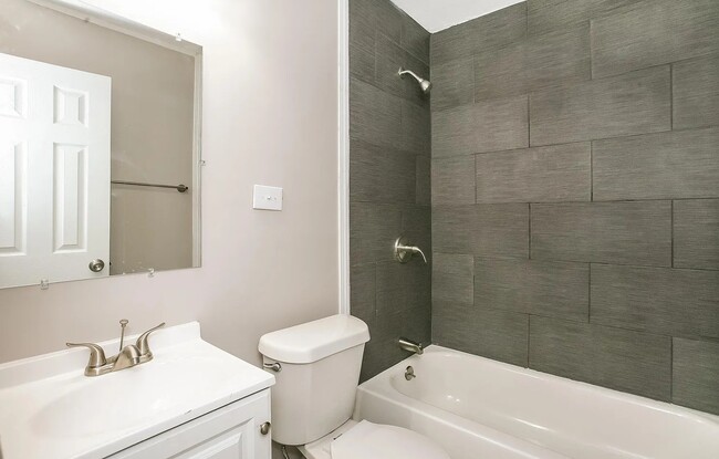 Beautifully renovated bathroom with tile shower and tub. Updated appliances of course. - 1902 E Calvert St