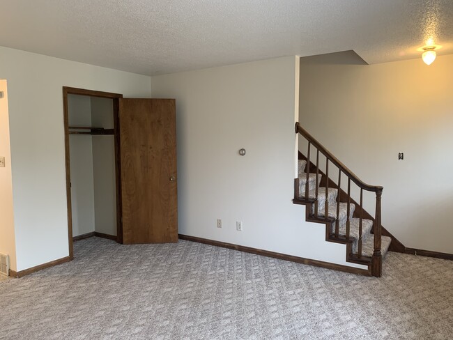 Large living area including coat closet. - 1320 5th St W