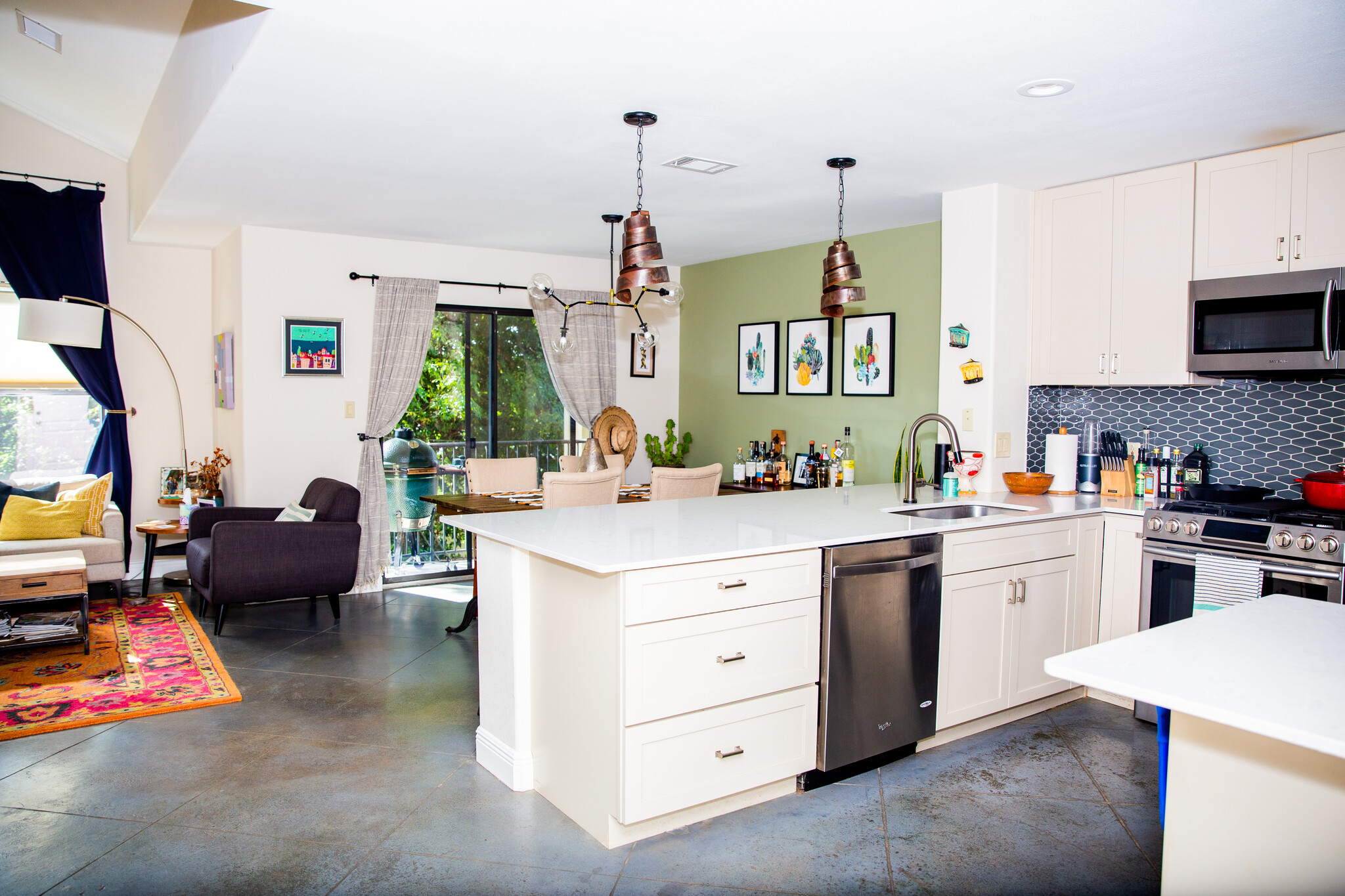 Open kitchen, dining, and living area. - 3607 Clawson Rd