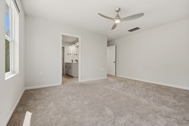 Building Photo - Move-In Ready 4BR Home | Deck, Patio & Open Concept Living