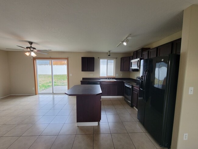 Building Photo - Comfortable 4-Bedroom Home with Fenced Bac...
