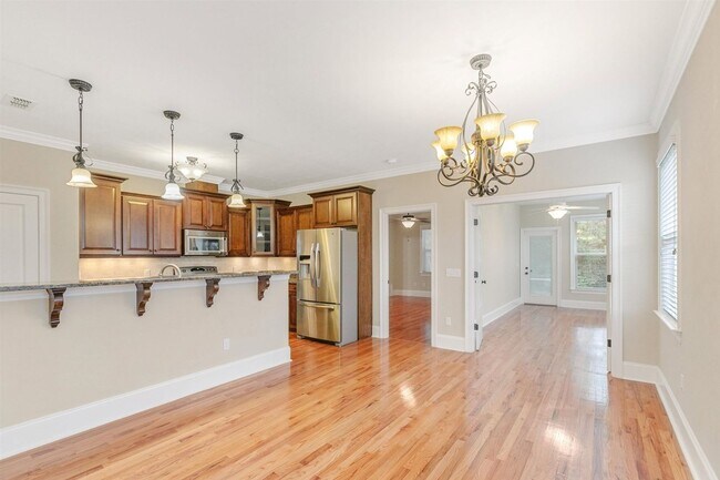 Building Photo - Captivating 3 bedroom house available for rent, wood floors, garage, screened porch renting for $...