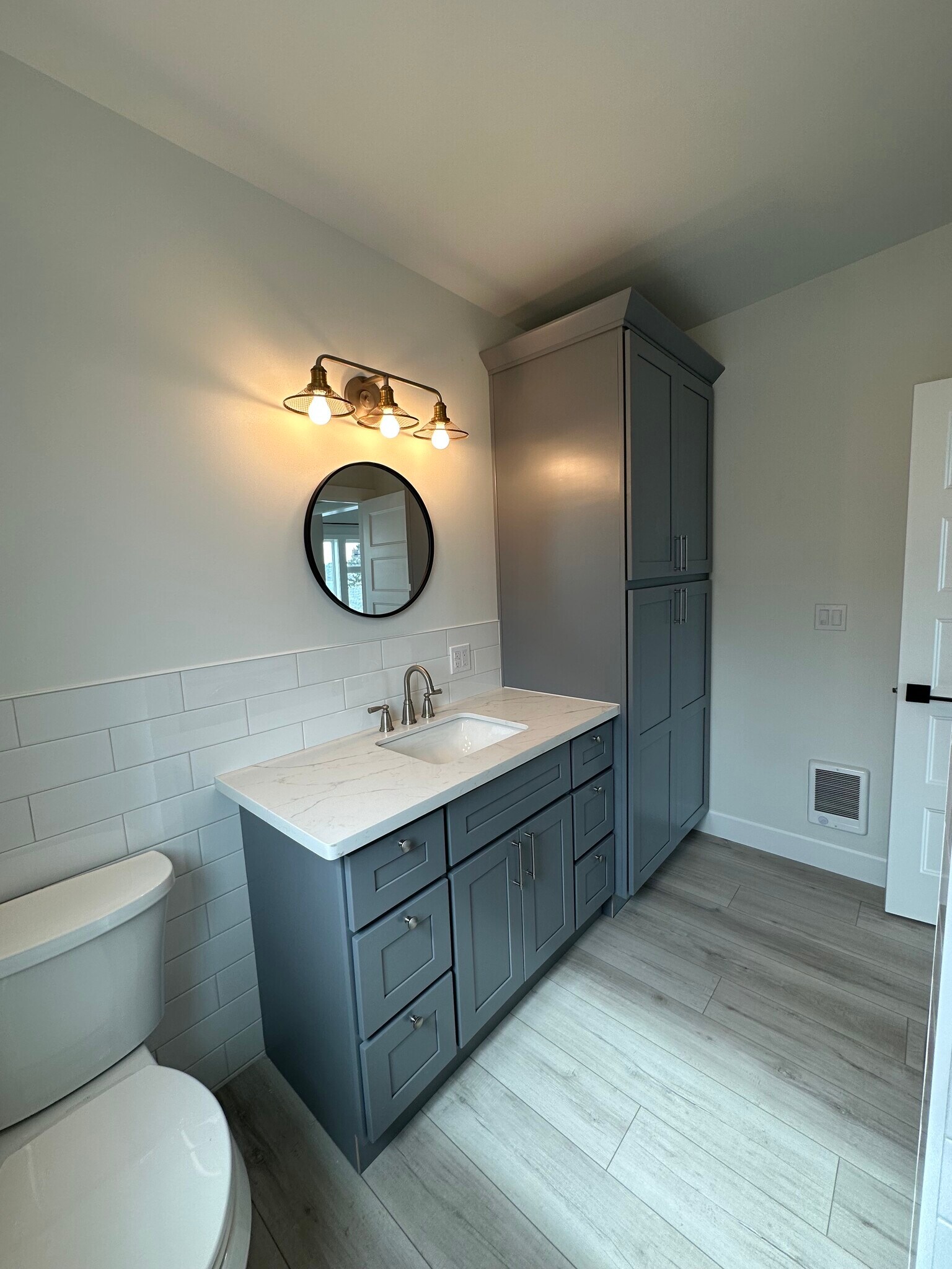 Beautiful bathroom with Quartz Counters & large Linen Pantry. - 3020 N 33rd St