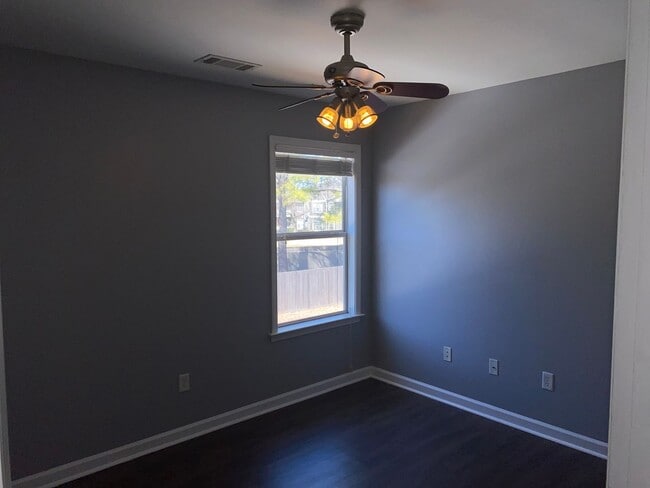 Building Photo - Rare home on the island! Large fenced in back yard! Pets are allowed. Owner will manage.