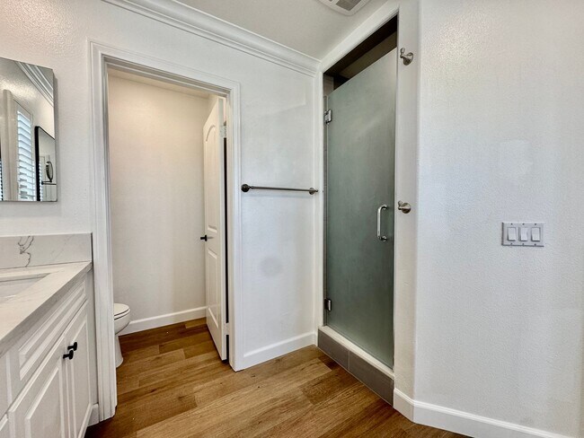 Building Photo - Beautifully Remodel Townhouse with AC & Two Car Garage!