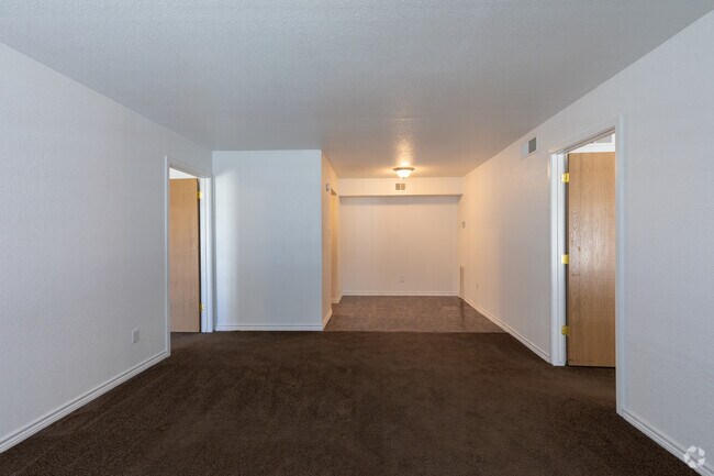 Living and dining room - American Village Apartments