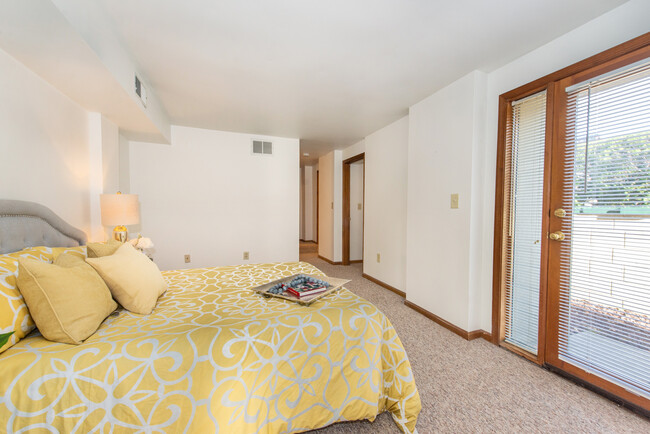 ground floor bedroom with walk-in closet and door to the private patio - 21 Springfield Ave