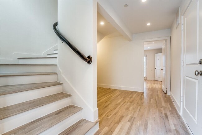 Building Photo - Beautiful townhome featuring granite countertops, hard wood floors, and a small private yard grea...