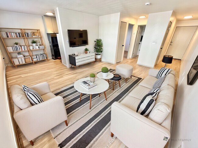 Step into a chic and cozy living room that combines style with comfort. - Flats at Sloan's Lake West